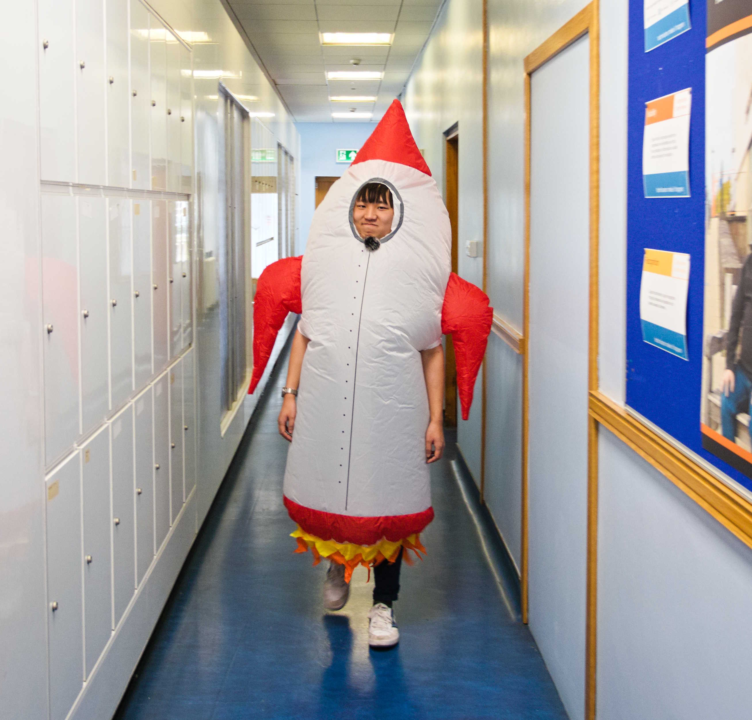Mr Wang in a rocket costume.